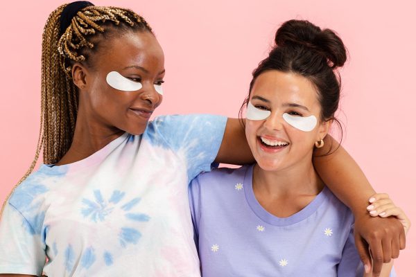 2 women on pink background